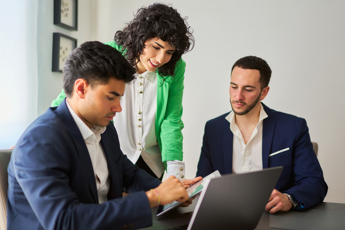 Credit counsellors reviewing a debt management plan and financial documents