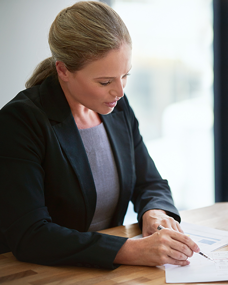 Credit counsellor reviewing financial documents during a debt assessment
